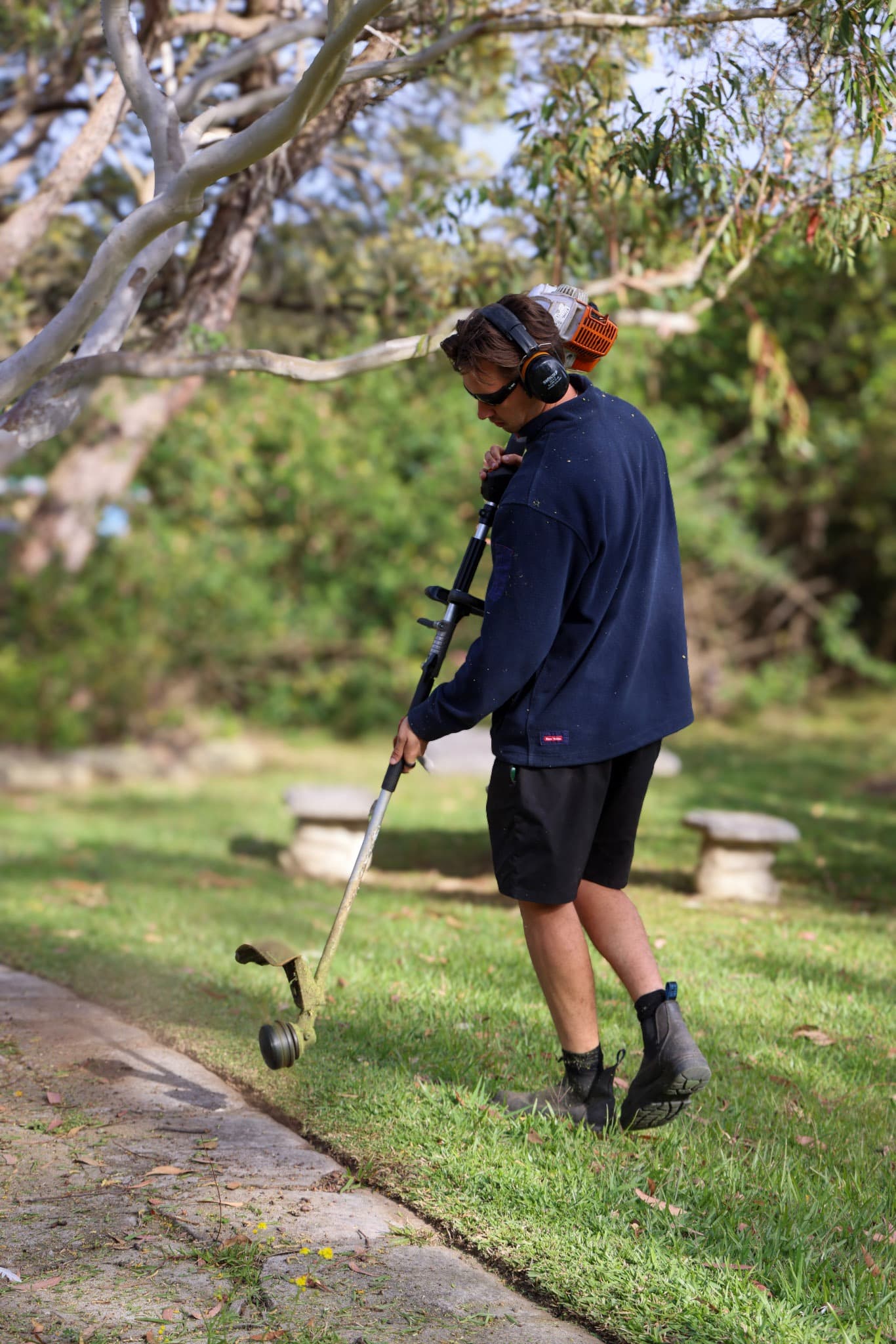 Gardening Sydney crew member edging a garden bed